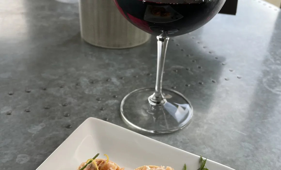 Salmon Tartlet with a glass of red wine